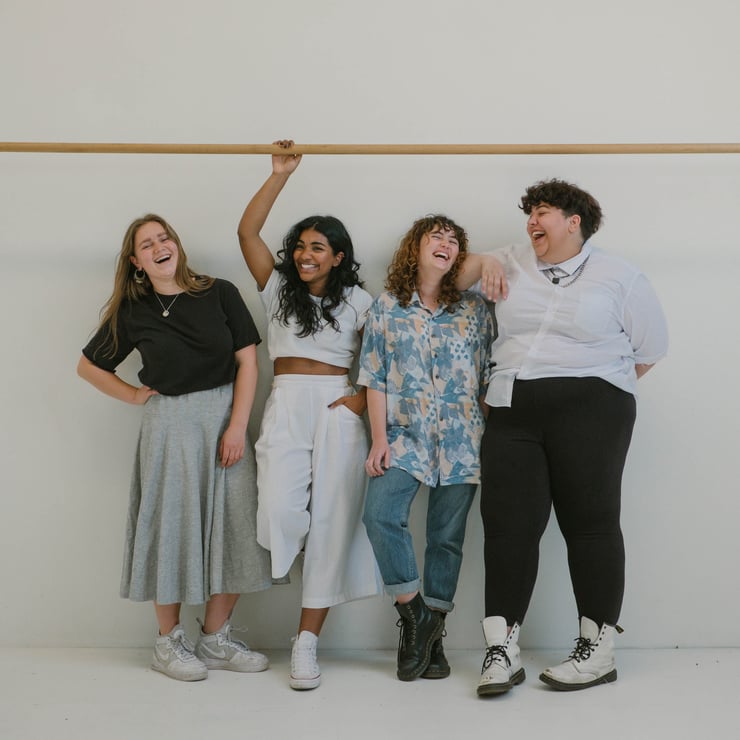 Four young women laughing. Photo by Gemma Chua-Tran courtesy of Unsplash.